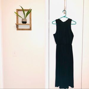 Black ribbed jumpsuit with mock neck and open back